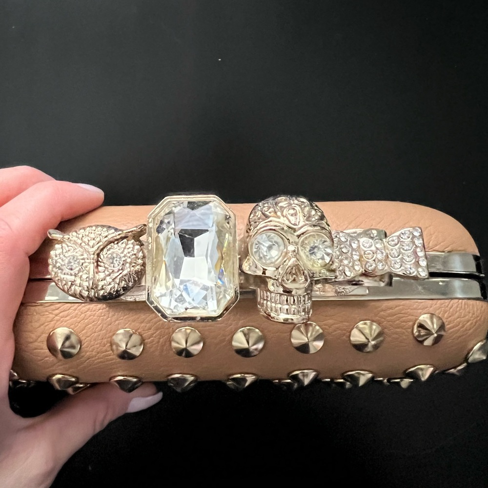Knuckle embellished faux leather clutch 💋